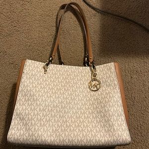 Michael Kors purse used but still lots of life. Has the inside dividers .